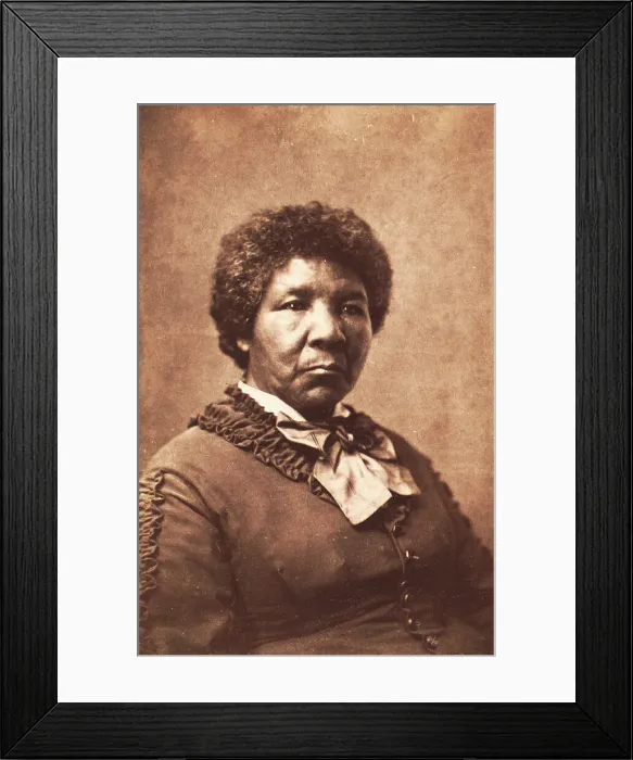 Framed Print : Studio portrait of unidentified woman dressed in a rouched jacket and large striped... c1870-c1879. Creator: Unknown Framed Print : Studio portrait of unidentified woman dressed in a rouched jacket and large striped... c1870-c1879. Creator: Unknown