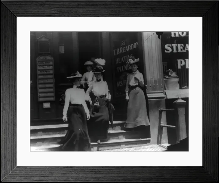 Framed Print : Women coming from work, Cal.?. Store window reads T.B. Reardon, heating and plumbing, 1903. Creator: Frances Benjamin Johnston Framed Print : Women coming from work, Cal.?. Store window reads T.B. Reardon, heating and plumbing, 1903. Creator: Frances Benjamin Johnston