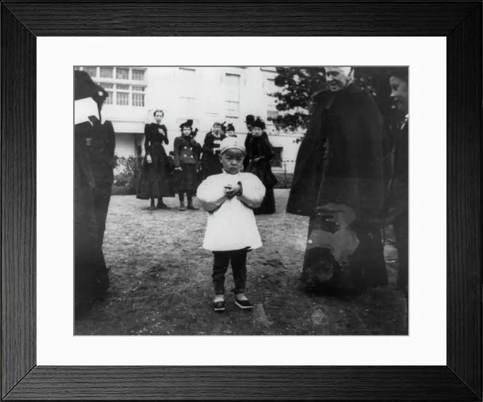 Framed Print : One of the youngest egg rollers on the White House lawn, 1898. Creator: Frances Benjamin Johnston Framed Print : One of the youngest egg rollers on the White House lawn, 1898. Creator: Frances Benjamin Johnston