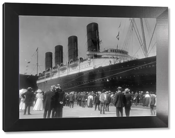 LUSITANIA arriving in N.Y. for first time, Sept. 13, 1907: starboard view; crowd at dock... 1907. Creator: Frances Benjamin Johnston