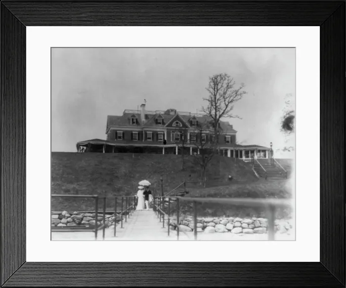 Framed Print : Yacht club, Oyster Bay, Long Island, N.Y. Couple walking on far end of bridge or pier, 1905. Creator: Frances Benjamin Johnston