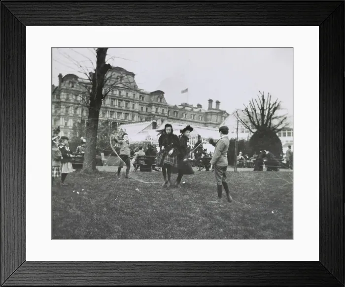 Framed Print : Children jumping rope on the White House lawn during annual Easter egg roll with State, War...1898. Creator: Frances Benjamin Johnston Framed Print : Children jumping rope on the White House lawn during annual Easter egg roll with State, War...1898. Creator: Frances Benjamin Johnston