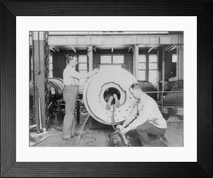 Framed Print : Three men working on large gun in Naval Gun Factory, Washington, D.C. one of the men lying... 1903 Creator: Frances Benjamin Johnston Framed Print : Three men working on large gun in Naval Gun Factory, Washington, D.C. one of the men lying... 1903 Creator: Frances Benjamin Johnston