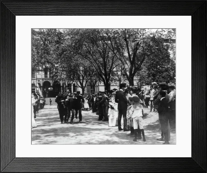 Framed Print : U.S. Naval Academy, Annapolis: 4 midshipmen carrying a man; crowd of guests along sidewalk, (1902?). Creator: Frances Benjamin Johnston Framed Print : U.S. Naval Academy, Annapolis: 4 midshipmen carrying a man; crowd of guests along sidewalk, (1902?). Creator: Frances Benjamin Johnston