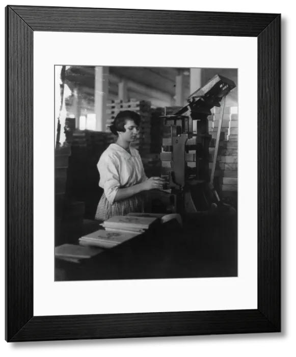 Framed Print : Wooden Box Industry: young woman working at machine, c1910. Creator: Frances Benjamin Johnston Framed Print : Wooden Box Industry: young woman working at machine, c1910. Creator: Frances Benjamin Johnston