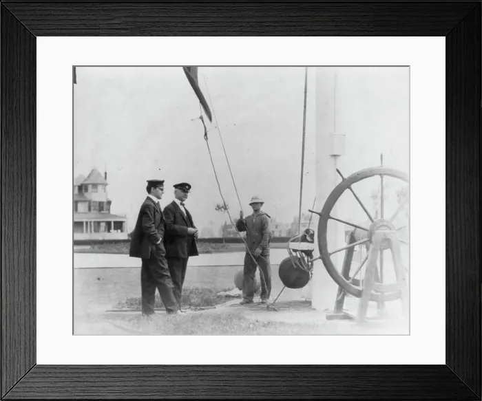 Framed Print : New York Yacht Club, Oyster Bay, L.I. 1905: 2 men watching sailor hoist flag, 1905. Creator: Frances Benjamin Johnston Framed Print : New York Yacht Club, Oyster Bay, L.I. 1905: 2 men watching sailor hoist flag, 1905. Creator: Frances Benjamin Johnston