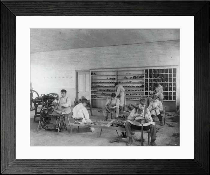 Framed Print : Classroom scenes at Carlisle, Pa. Indian School. Shoe making and repairing; male students, 1901. Creator: Frances Benjamin Johnston Framed Print : Classroom scenes at Carlisle, Pa. Indian School. Shoe making and repairing; male students, 1901. Creator: Frances Benjamin Johnston