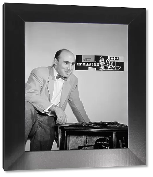 Portrait of George Avakian in his office or home, New York, N.Y.(?), 1938. Creator: William Paul Gottlieb