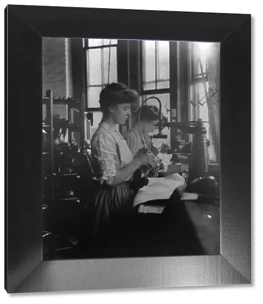 Shoe factories, Lynn, Mass.: 2 women working in shoe factory, (1895?). Creator: Frances Benjamin Johnston