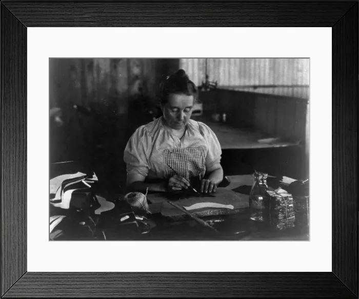 Framed Print : Woman seated at a table, working in a shoe factory, Lynn, Mass. (1895?). Creator: Frances Benjamin Johnston Framed Print : Woman seated at a table, working in a shoe factory, Lynn, Mass. (1895?). Creator: Frances Benjamin Johnston