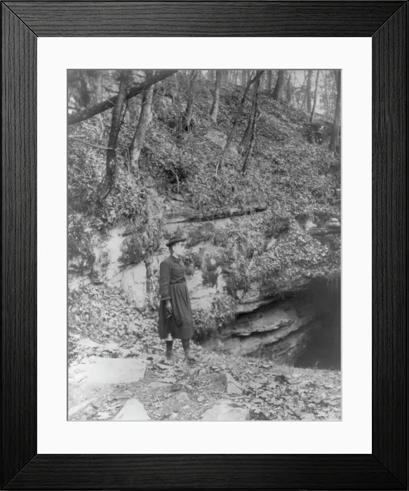 Framed Print : Frances Benjamin Johnston, full, standing by wooded cliff at entrance to Mammoth Cave, (c1891?). Creator: Frances Benjamin Johnston Framed Print : Frances Benjamin Johnston, full, standing by wooded cliff at entrance to Mammoth Cave, (c1891?). Creator: Frances Benjamin Johnston