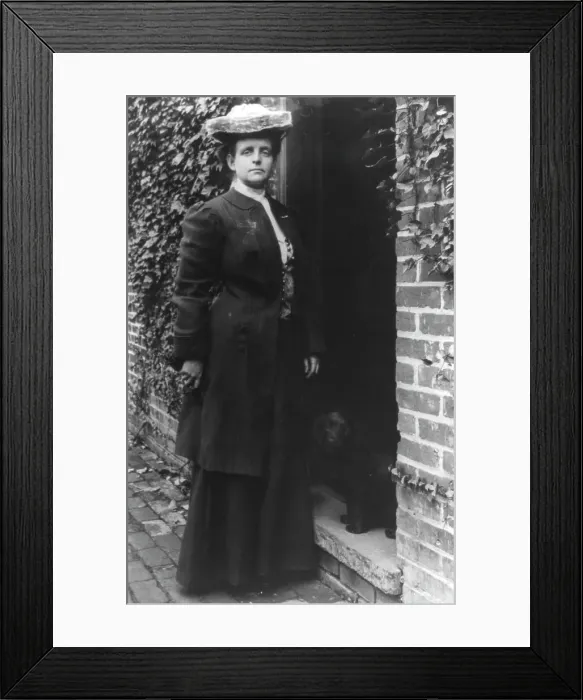 Framed Print : Frances Benjamin Johnston, in doorway with cocker spaniel, n.d.. Creator: Frances Benjamin Johnston