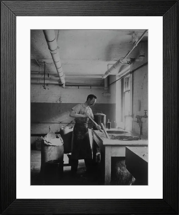 Framed Print : Worker prepares gum for postage stamps in the Stamp Division at the Bureau of Engraving... c1895. Creator: Frances Benjamin Johnston Framed Print : Worker prepares gum for postage stamps in the Stamp Division at the Bureau of Engraving... c1895. Creator: Frances Benjamin Johnston