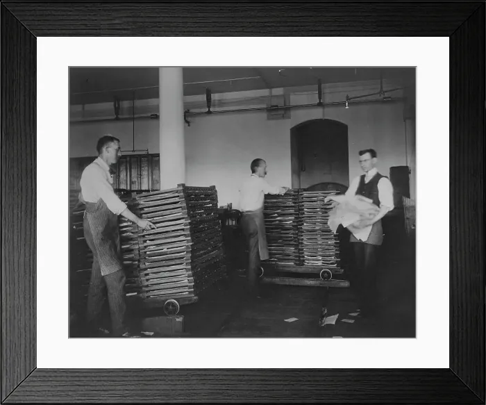 Framed Print : Workers moving newly printed currency into a drying box where sheets will dry before...c1890. Creator: Frances Benjamin Johnston Framed Print : Workers moving newly printed currency into a drying box where sheets will dry before...c1890. Creator: Frances Benjamin Johnston