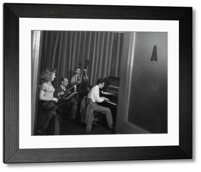 Framed Print : Portrait of Helen Carr, Sammy Herman, Joe Bianco, and Donn Trenner, Nola's, N.Y. ca. Feb. 1947. Creator: William Paul Gottlieb Framed Print : Portrait of Helen Carr, Sammy Herman, Joe Bianco, and Donn Trenner, Nola's, N.Y. ca. Feb. 1947. Creator: William Paul Gottlieb