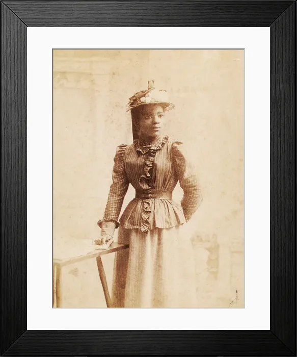 Framed Print : Woman in hat decorated with flowers, and striped blouse, (1900-1950?). Creator: Madison Art Studio Framed Print : Woman in hat decorated with flowers, and striped blouse, (1900-1950?). Creator: Madison Art Studio