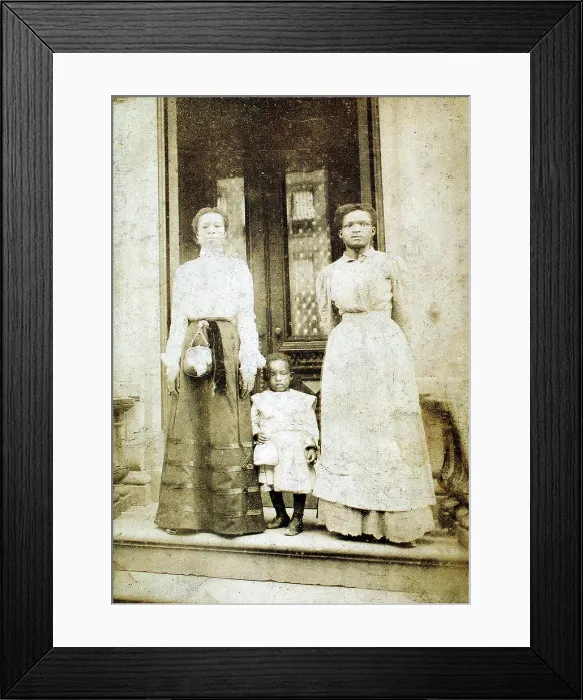 Framed Print : Two women and a child standing on step in front of a doorway of a house, c1900. Creator: Eckehard Munck Framed Print : Two women and a child standing on step in front of a doorway of a house, c1900. Creator: Eckehard Munck