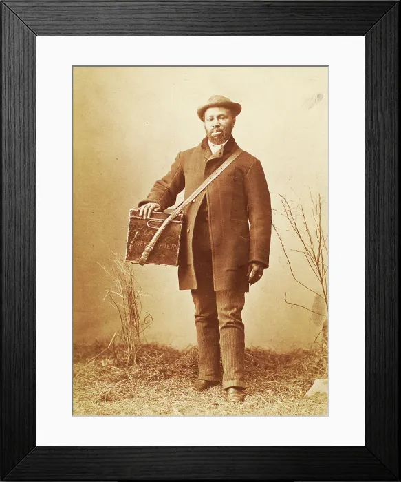 Framed Print : Studio portrait of man holding box labelled Confectionery, c1880. Creator: William Notman Framed Print : Studio portrait of man holding box labelled Confectionery, c1880. Creator: William Notman
