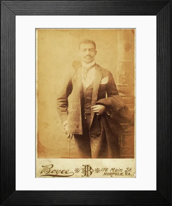 Framed Print : Dapper man, coat draped over his arm, and cane in hand, c1880-c1889. Creator: Unknown Framed Print : Dapper man, coat draped over his arm, and cane in hand, c1880-c1889. Creator: Unknown