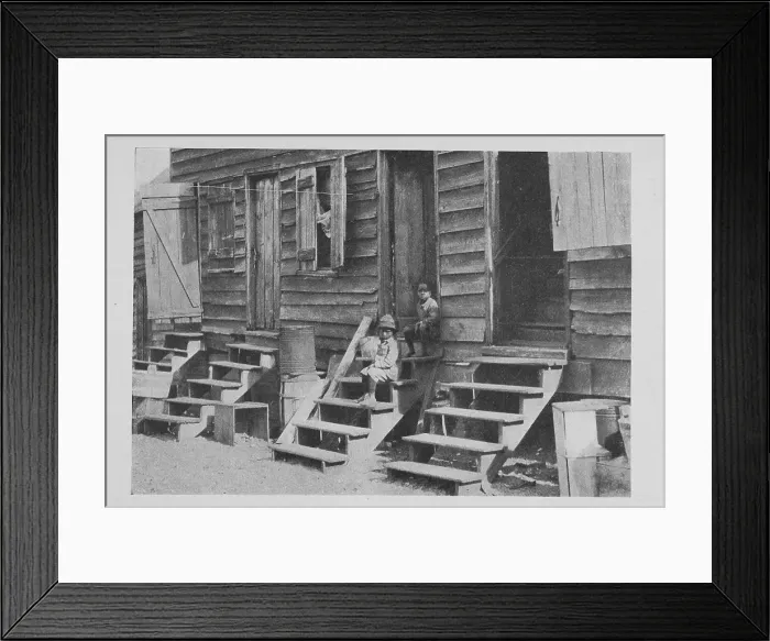 Framed Print : African American children sitting on the stairs in front of their house, 1922. Creator: Unknown Framed Print : African American children sitting on the stairs in front of their house, 1922. Creator: Unknown