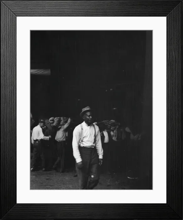 Framed Print : Unloading bananas, New Orleans, between 1920 and 1926. Creator: Arnold Genthe Framed Print : Unloading bananas, New Orleans, between 1920 and 1926. Creator: Arnold Genthe