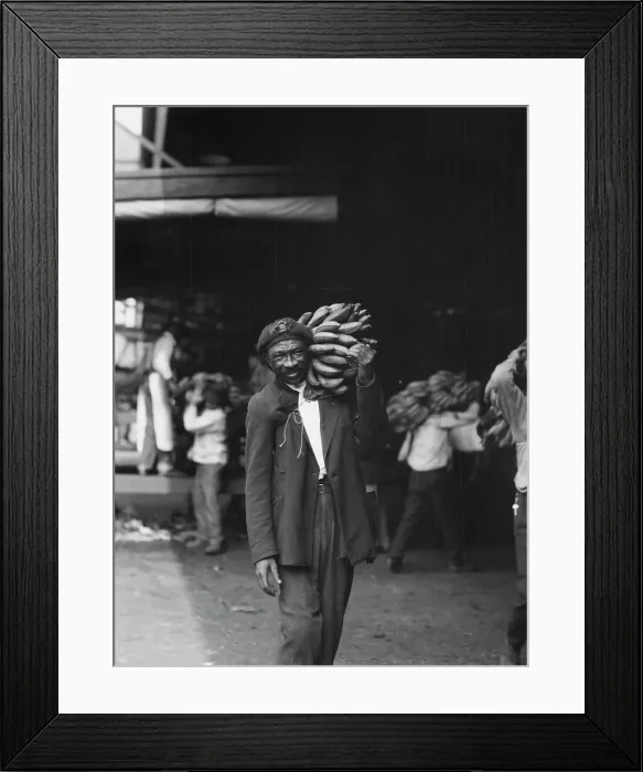 Framed Print : Unloading bananas, New Orleans, between 1920 and 1926. Creator: Arnold Genthe Framed Print : Unloading bananas, New Orleans, between 1920 and 1926. Creator: Arnold Genthe