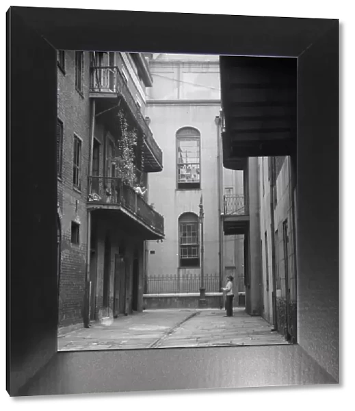 Cathedral Alley, New Orleans, between 1920 and 1926. Creator: Arnold Genthe