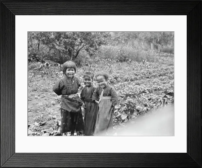 Framed Print : Three Ainu children standing in a garden, 1908. Creator: Arnold Genthe Framed Print : Three Ainu children standing in a garden, 1908. Creator: Arnold Genthe