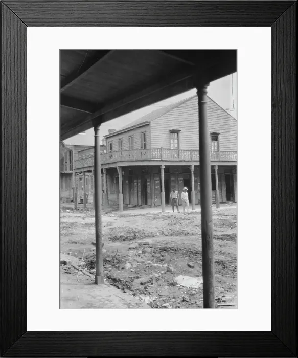 Framed Print : Two men crossing an unpaved street, New Orleans or Charleston, South Carolina, between 1920 and 1926 Creator: Arnold Genthe Framed Print : Two men crossing an unpaved street, New Orleans or Charleston, South Carolina, between 1920 and 1926 Creator: Arnold Genthe