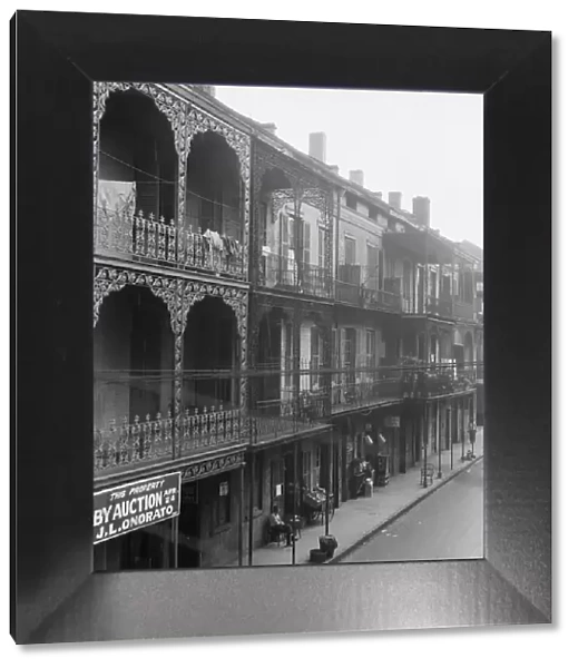 View down a street, New Orleans, between 1920 and 1926. Creator: Arnold Genthe