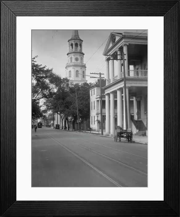 Framed Print : View down street to St. Michael's Church, Charleston, South Carolina, between 1920 and 1926. Creator: Arnold Genthe Framed Print : View down street to St. Michael's Church, Charleston, South Carolina, between 1920 and 1926. Creator: Arnold Genthe