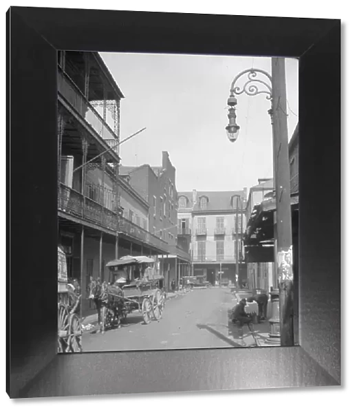 View down a street, New Orleans or Charleston, South Carolina, between 1920 and 1926. Creator: Arnold Genthe