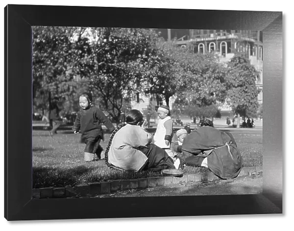 A picnic on Portsmouth Square, Chinatown, San Francisco, between 1896 and 1906. Creator: Arnold Genthe