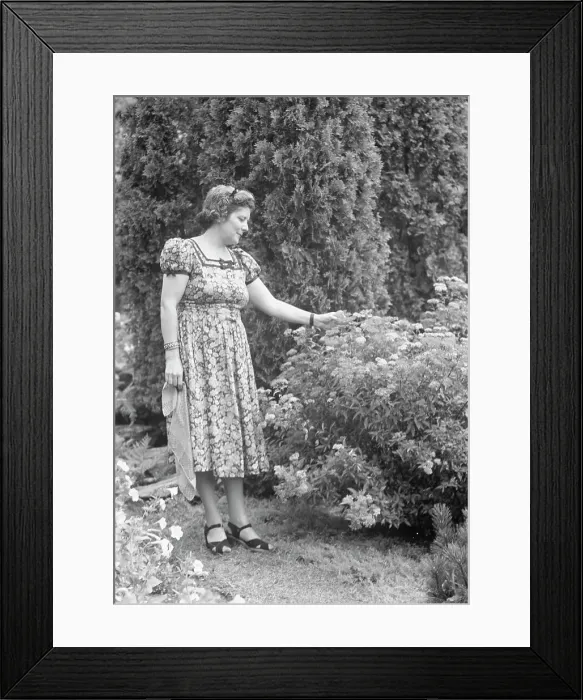Framed Print : Javits, Benjamin, Mrs. standing outdoors, ca. 1925. Creator: Arnold Genthe Framed Print : Javits, Benjamin, Mrs. standing outdoors, ca. 1925. Creator: Arnold Genthe