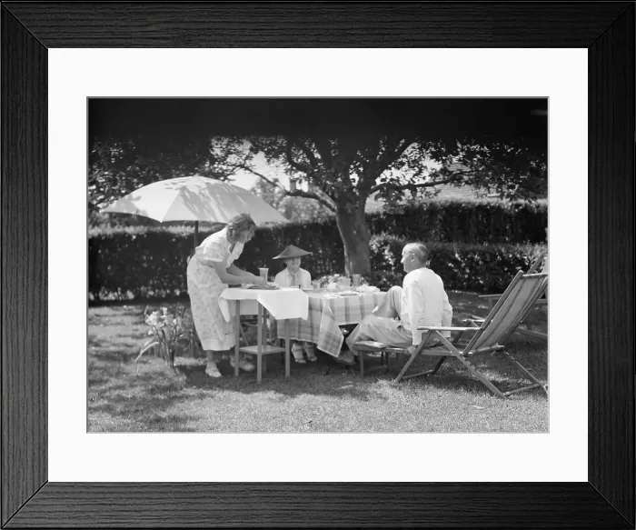 Framed Print : Leonard, Mr. and Mrs. eating outdoors, between 1926 and 1938. Creator: Arnold Genthe Framed Print : Leonard, Mr. and Mrs. eating outdoors, between 1926 and 1938. Creator: Arnold Genthe
