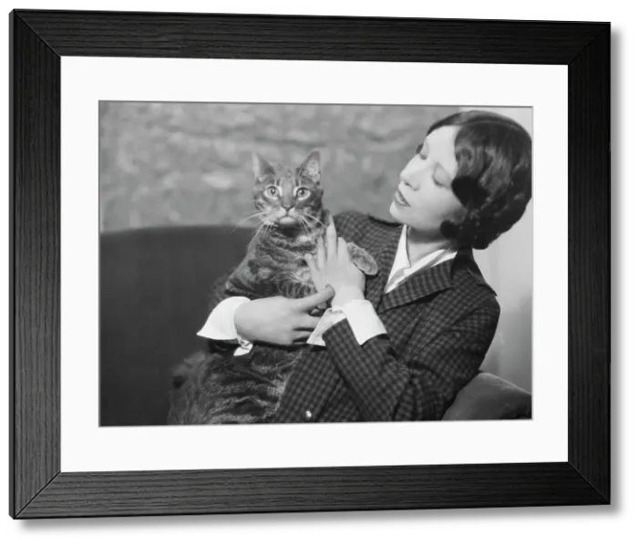 Framed Print : Cumner, Gwendolyn, Miss, with cat (possibly Pudge), portrait photograph, 1928 Creator: Arnold Genthe Framed Print : Cumner, Gwendolyn, Miss, with cat (possibly Pudge), portrait photograph, 1928 Creator: Arnold Genthe