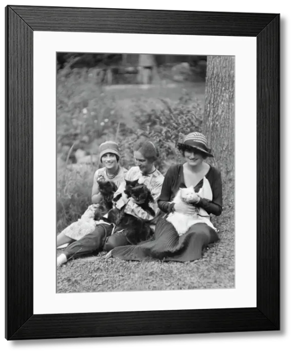 Framed Print : Egger, Gabrielle, Miss, and friends, with cats, seated outdoors, between 1926 and 1930. Creator: Arnold Genthe Framed Print : Egger, Gabrielle, Miss, and friends, with cats, seated outdoors, between 1926 and 1930. Creator: Arnold Genthe