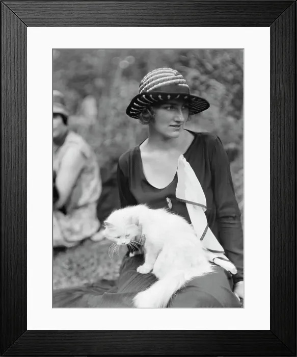 Framed Print : Egger, Gabrielle, Miss, with cat, seated outdoors, between 1926 and 1930. Creator: Arnold Genthe Framed Print : Egger, Gabrielle, Miss, with cat, seated outdoors, between 1926 and 1930. Creator: Arnold Genthe