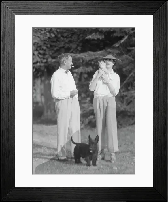 Framed Print : Leonard, Mr. and Mrs. with cat and dog, standing outdoors, between 1926 and 1938. Creator: Arnold Genthe Framed Print : Leonard, Mr. and Mrs. with cat and dog, standing outdoors, between 1926 and 1938. Creator: Arnold Genthe