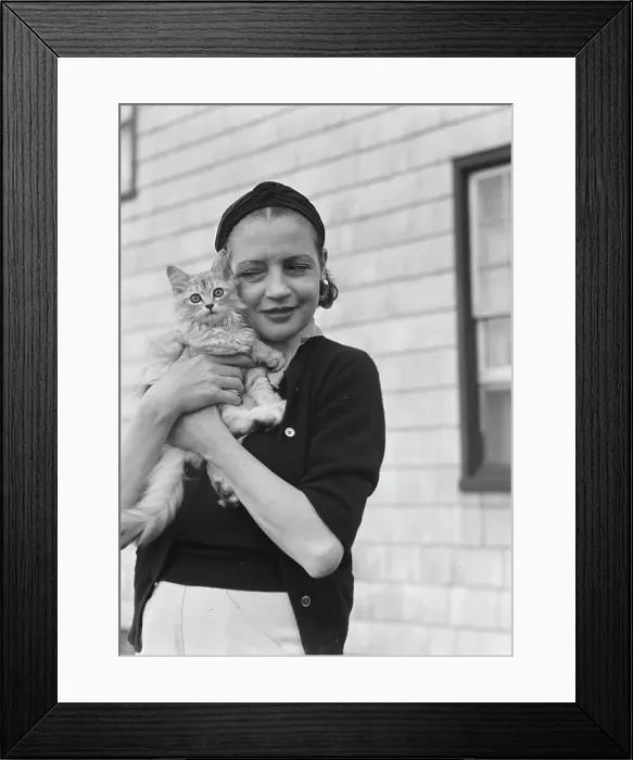 Framed Print : Leonard, Mrs. with cat, standing outdoors, between 1926 and 1938. Creator: Arnold Genthe Framed Print : Leonard, Mrs. with cat, standing outdoors, between 1926 and 1938. Creator: Arnold Genthe