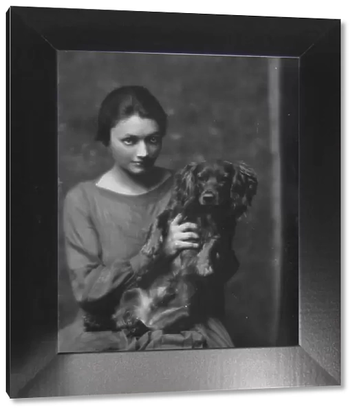 Miss Katharine Cornell, with dog, portrait photograph, 1917 Nov. 20. Creator: Arnold Genthe