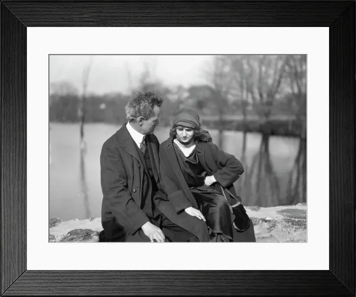 Framed Print : Arnold Genthe seated outdoors with a woman friend, between 1896 and 1942. Creator: Arnold Genthe Framed Print : Arnold Genthe seated outdoors with a woman friend, between 1896 and 1942. Creator: Arnold Genthe
