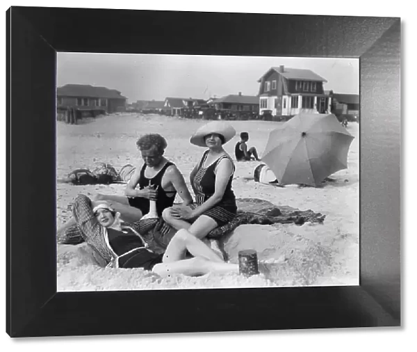 Arnold Genthe with two women friends in Long Beach, New York, between 1911 and 1942. Creator: Arnold Genthe