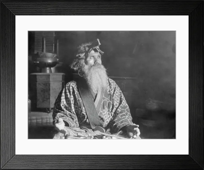 Framed Print : Ainu chief wearing a headdress seated with a sword in his lap, 1908. Creator: Arnold Genthe Framed Print : Ainu chief wearing a headdress seated with a sword in his lap, 1908. Creator: Arnold Genthe