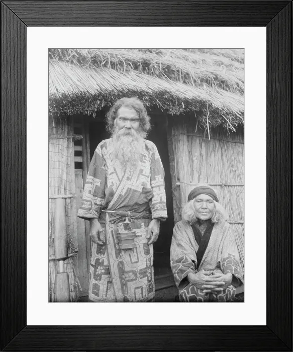 Framed Print : Ainu man and seated woman at the entrance of a hut, 1908. Creator: Arnold Genthe Framed Print : Ainu man and seated woman at the entrance of a hut, 1908. Creator: Arnold Genthe