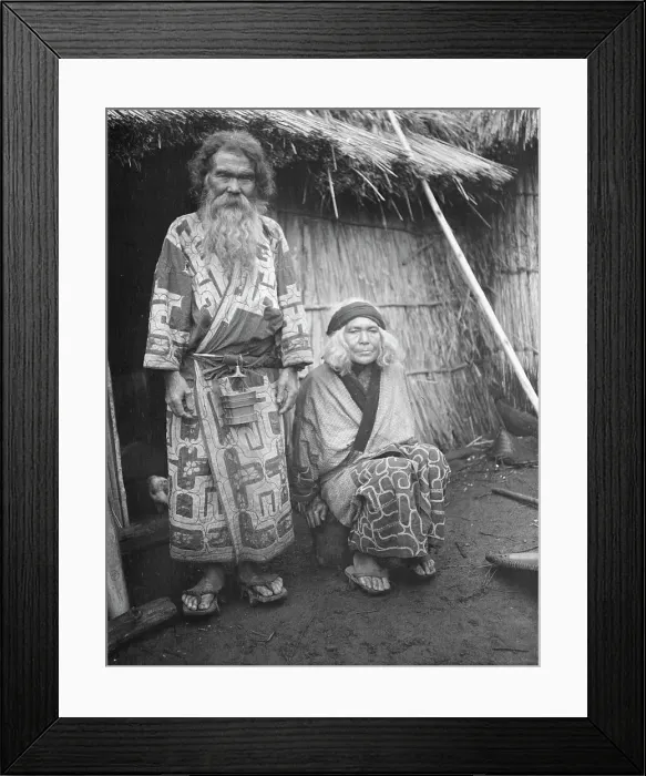 Framed Print : Ainu man and seated woman at the entrance of a hut, 1908. Creator: Arnold Genthe Framed Print : Ainu man and seated woman at the entrance of a hut, 1908. Creator: Arnold Genthe