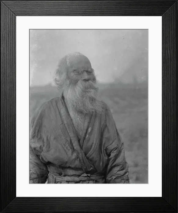 Framed Print : Ainu man standing outside, 1908. Creator: Arnold Genthe Framed Print : Ainu man standing outside, 1908. Creator: Arnold Genthe