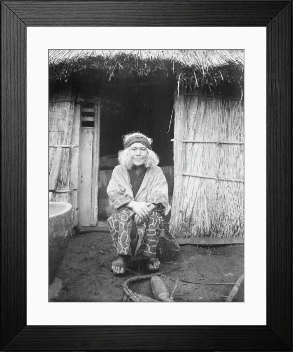 Framed Print : Ainu woman seated in front of the doorway of a hut, 1908. Creator: Arnold Genthe Framed Print : Ainu woman seated in front of the doorway of a hut, 1908. Creator: Arnold Genthe