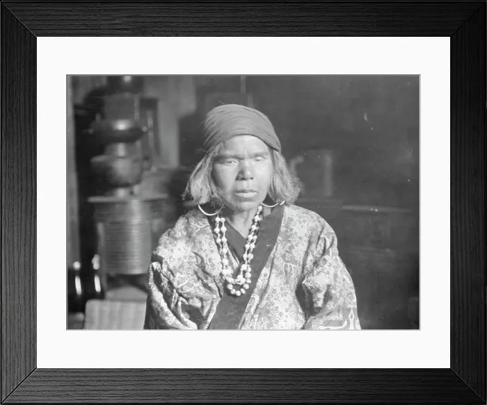 Framed Print : Ainu woman wearing a headscarf, earrings, and a necklace, 1908. Creator: Arnold Genthe Framed Print : Ainu woman wearing a headscarf, earrings, and a necklace, 1908. Creator: Arnold Genthe