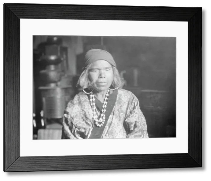 Framed Print : Ainu woman wearing a headscarf, earrings, and a necklace, 1908. Creator: Arnold Genthe Framed Print : Ainu woman wearing a headscarf, earrings, and a necklace, 1908. Creator: Arnold Genthe
